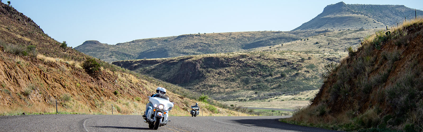 Bikers climbing Wild Rose Pass